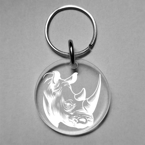 Custom wine glass charm with bold rhino engraving on clear acrylic – safari-themed design by Wildcrafts